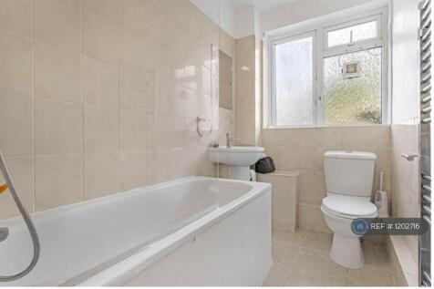 Floor To Ceiling Storage Cupboard In Bathroom