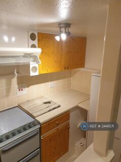 Wine Rack And Cupboards Above The Worktop 