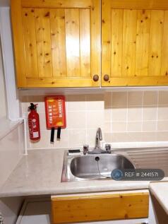 Cupboard Space Above The Sink And Fire Safety Kit