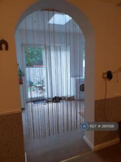 Archway Connecting Living Room And Dining Room