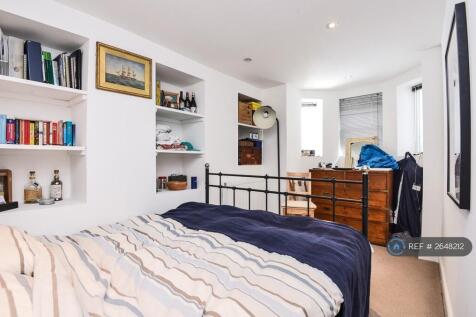 Basement Bedroom With Shelving