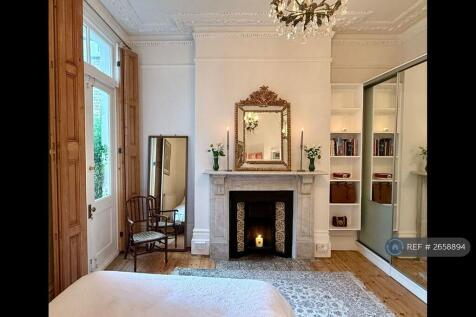 Bedroom With Pine Window Shutters