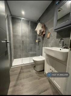 Ensuite Bathroom With Walk-In Shower Loo And Basin