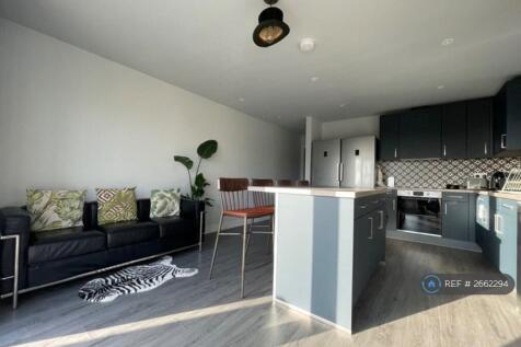 Sofa And Tv On The Wall In The  Kitchen