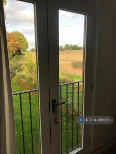 View Through French Doors In Bedroom
