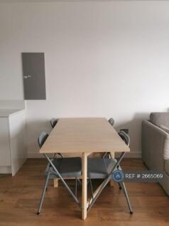 Dining Table In Between The Kitchen And Living Rm