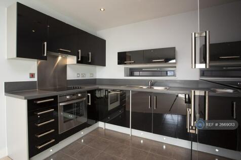 Kitchen With Black Gloss Units