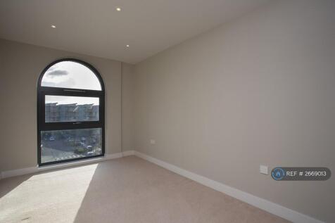 Bedroom With Arched Window