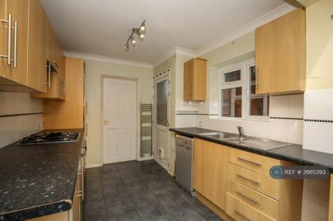 Kitchen With Range Of Base And Eye Level Units