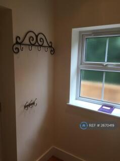 Just To Left Of Front Door