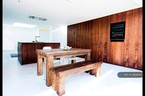 Kitchen Island And Dining Area With Wine Fridge