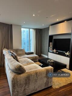 Living Room Kitchen Area With a Flat Screen Tv