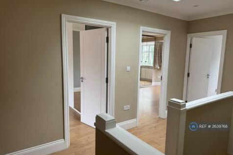 Bright Upstairs Hallway Lit With a Skylight