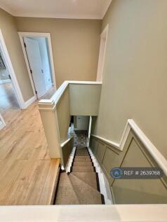 Panelled Staircase With Hessian Runner