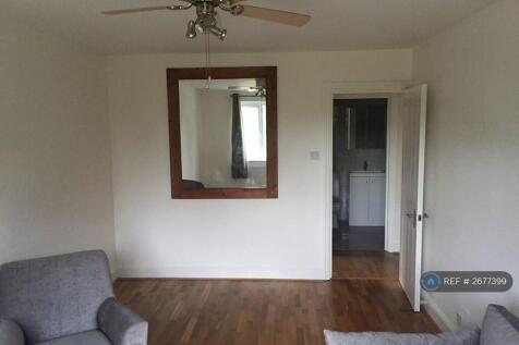 Living Room With Windows Out To The Common