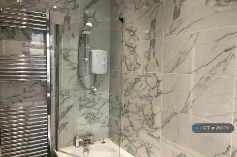 Luxury Fully Tiled Bathroom With Shower And Bath 