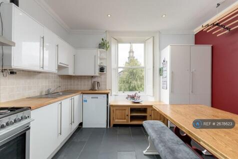 Spacious Kitchen With Dining Table
