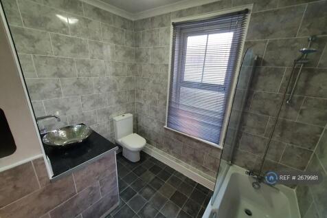 Bathroom With Bath And Over Bath Shower