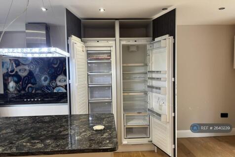 Kitchen With Tall Integrated Fridge Freezer 