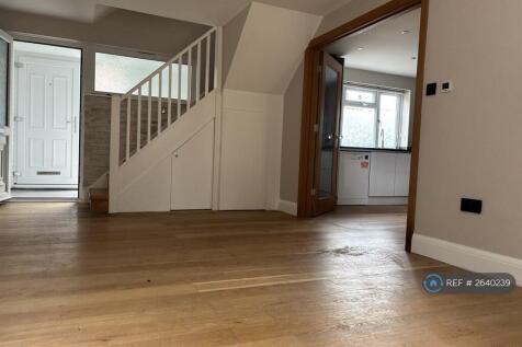Living Room With Double Glass Door To The Kitchen