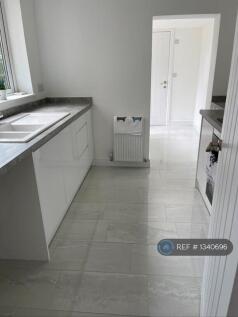 View From Kitchen To Middle Room And Cloakroom