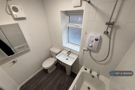 White Bathroom Suite With Shower Over Bath