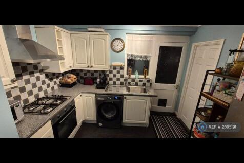 Fitted Kitchen With Additional Room