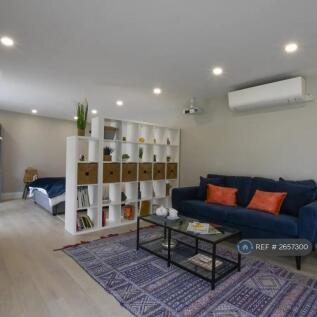 Open Plan Sitting Room And Bedroom 