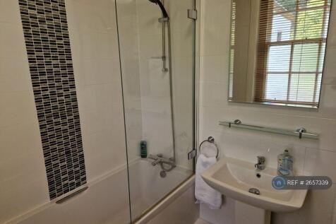 Full Size Bathroom With Over Bath Shower