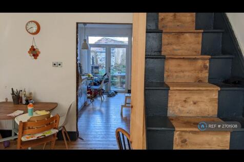 Entrance &amp; Stairs With View Through To The Kitchen