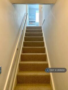 Stairs To Upper Floor With Handrail