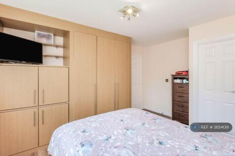 The Master Bedroom With Attached Bathroom