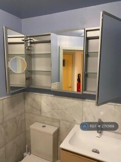 Bathroom With Ample Storage Behind Cabinet