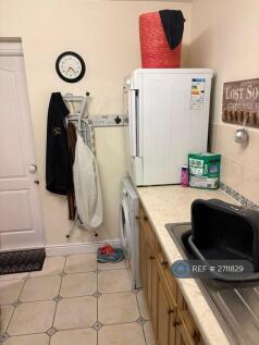 Utility Area With Door To Garage