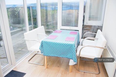 Dining Table In Conservatory Joined To Kitchen