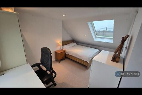 Large Loft Bedroom With Bedside Table And Drawers