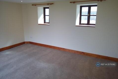 Living Room With Patio Doors Overlooking The Sea.