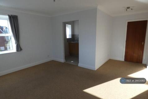 Spacious Living Area With Access To Kitchen