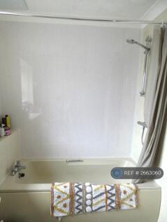 Bathroom With Separate Shower Unit Over Bath