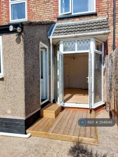 French Doors Down To Decking And Garden