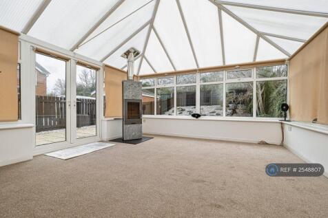 Conservatory With Log Burning Fireplace