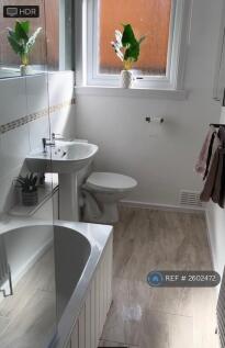 Large Modern Bathroom With Bath, Shower And Tiling