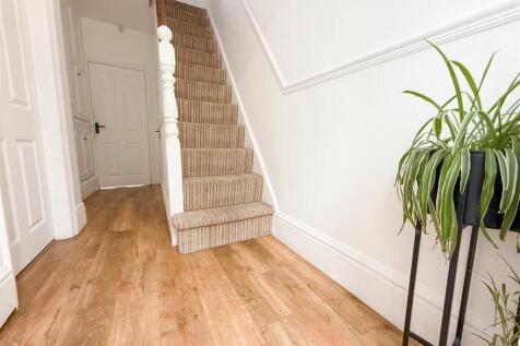STAIRS RISING TO THE FIRST FLOOR