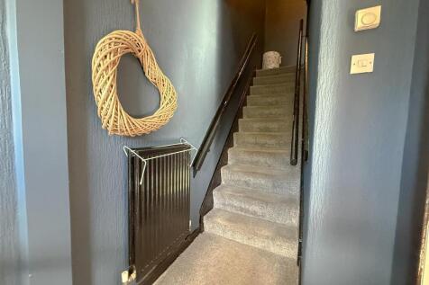 STAIRS RISING TO THE FIRST FLOOR