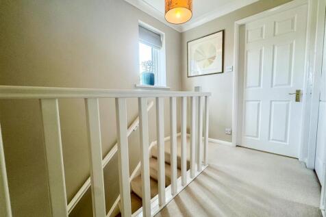 STAIRS RISING TO THE SECOND FLOOR LANDING