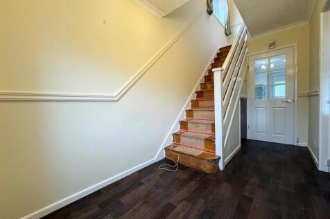 STAIRS RISING TO THE FIRST FLOOR