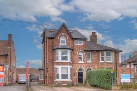 3 apartments at front with side access to Town Hou