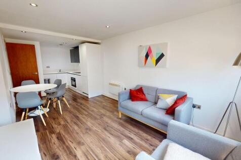Modern one-bedroom apartment in secure development with open-plan living, stylish kitchen, built-in storage, luxury bathroom, lift access, and great location near shops and transport.