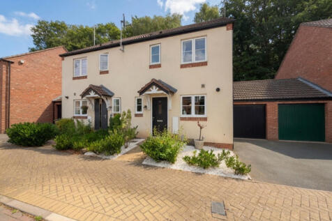Three-bedroom semi-detached home on the popular Nether Hall Estate. Featuring open-plan kitchen/living space, patio doors, downstairs WC, garage and driveway, plus a private woodland-backed rear garde