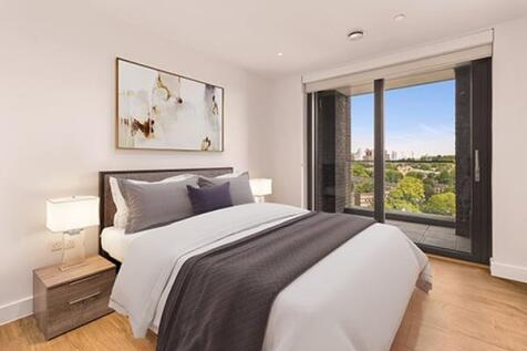 Wake up to breathtaking views in this elegantly designed bedroom.